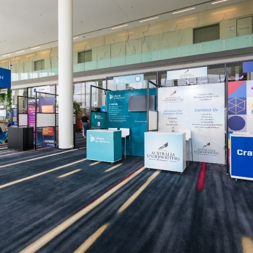 Exhibition booths in a conference hall.